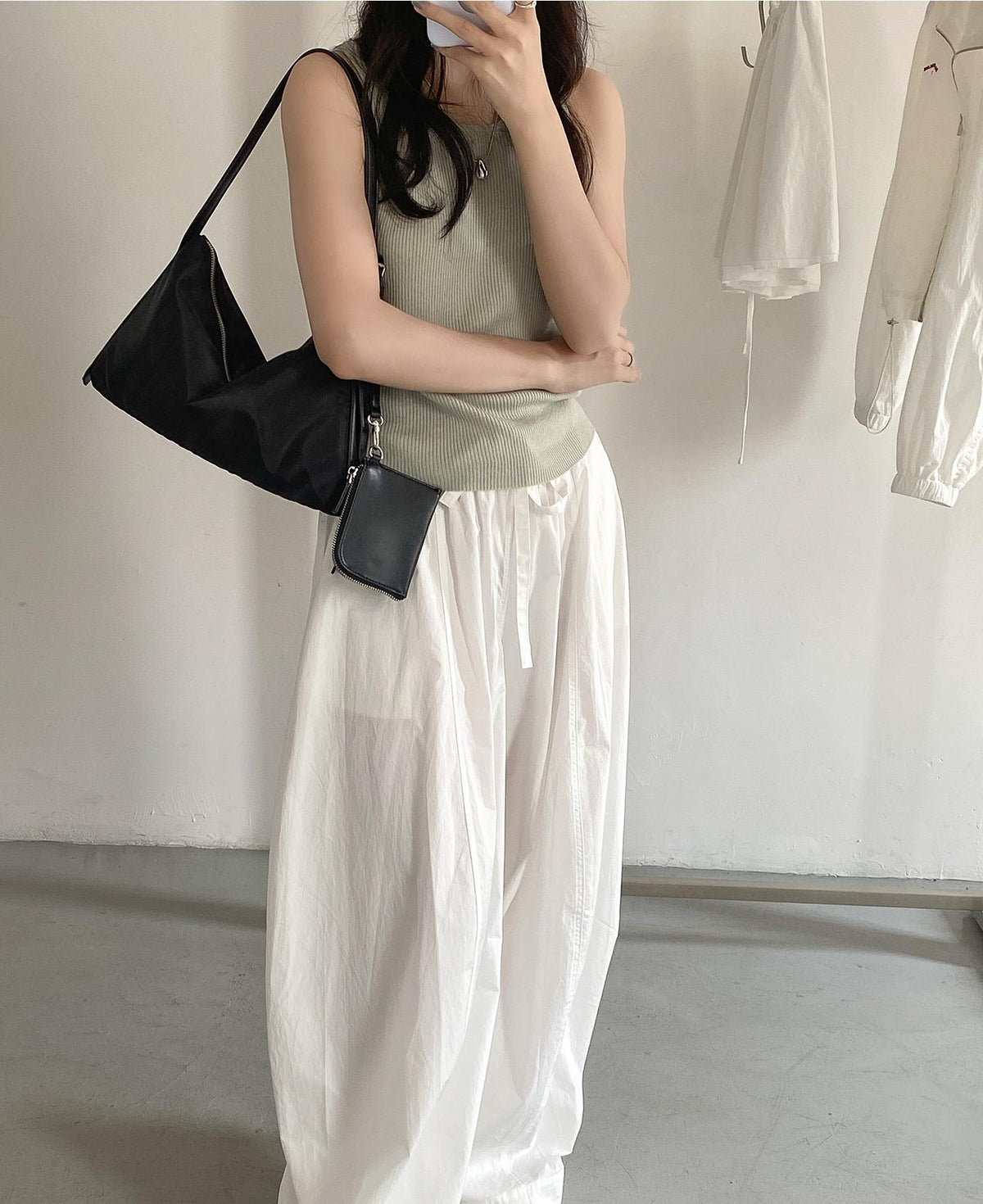 Black Small Hobo Shoulder Bag worn on shoulder