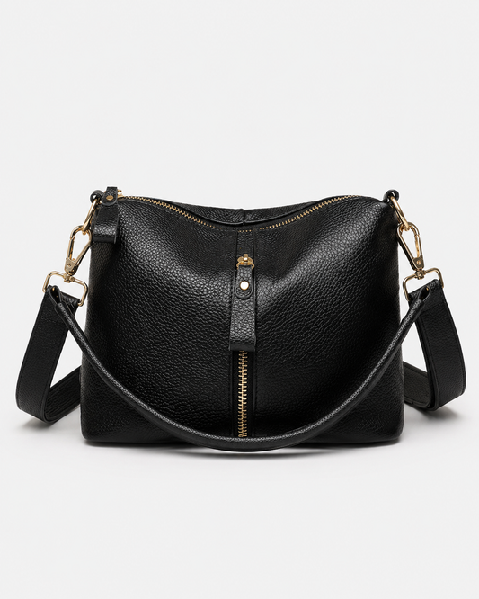 Front view of black PORT&LOTUS pebbled vegan leather crossbody bag with curved handle and adjustable shoulder strap