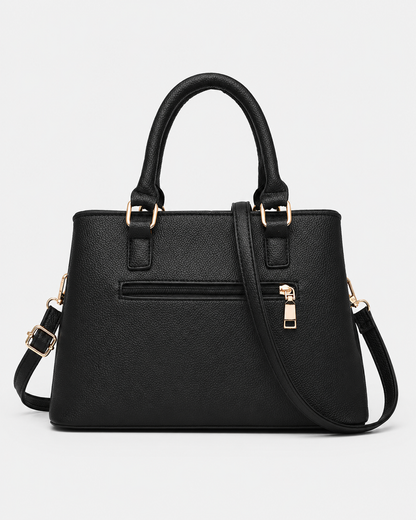 back view of black PORT&LOTUS textured top handle satchel bag rear zipper pocket detachable crossbody strap white background