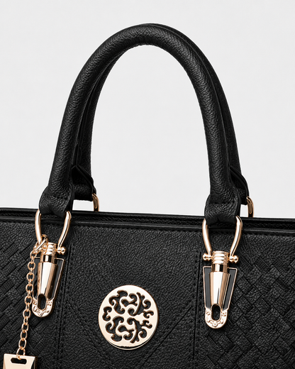 port&lotus black woven leather structured tote bag vintage hollow metal logo gold hardware top handle women fashion handbag closeup