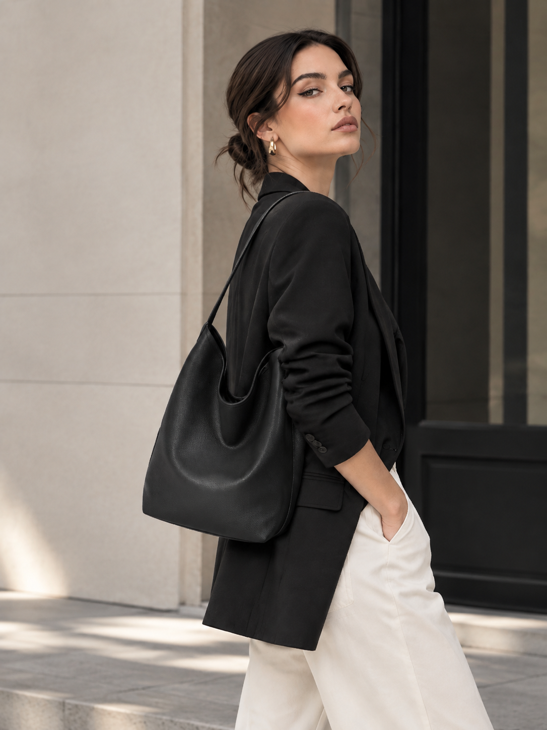 Black Hobo Shoulder Bag worn on shoulder